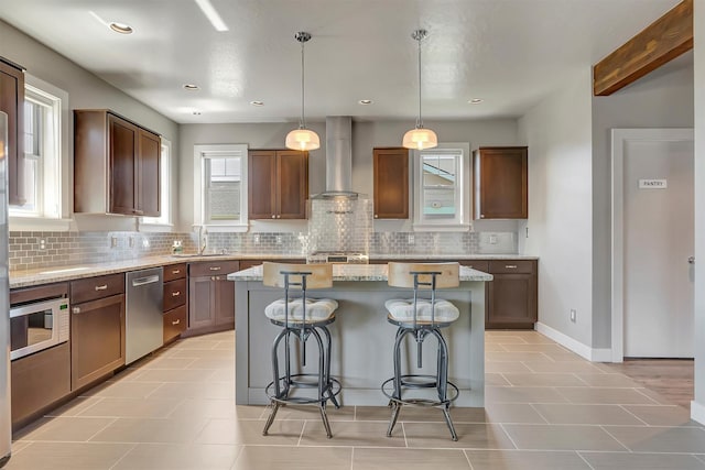 5010 Jeff Dr, Missoula, MT 59803 - kitchen with a sink, built in microwave, wall chimney exhaust hood, decorative backsplash, and stainless steel dishwasher