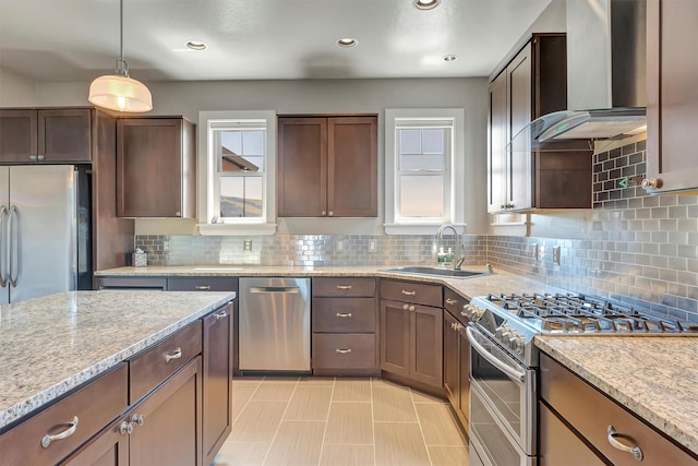 5010 Jeff Dr, Missoula, MT 59803 - kitchen featuring a sink, decorative backsplash, wall chimney range hood, and stainless steel appliances