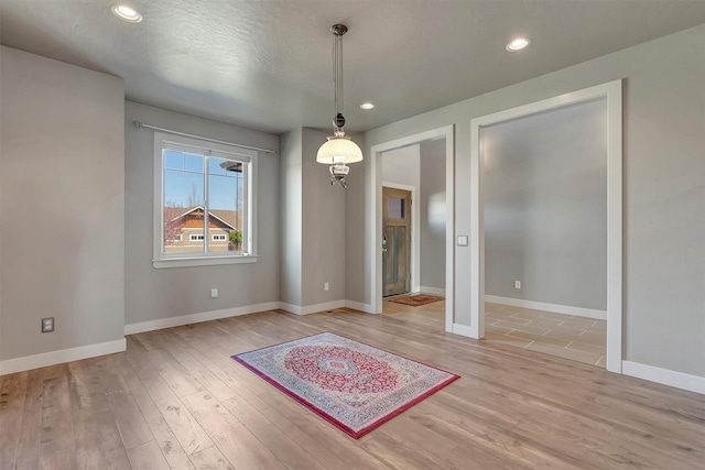 5010 Jeff Dr, Missoula, MT 59803 - unfurnished dining area featuring baseboards, recessed lighting, and light wood-style flooring