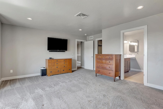 5010 Jeff Dr, Missoula, MT 59803 - bedroom featuring visible vents, baseboards, ensuite bathroom, light colored carpet, and recessed lighting