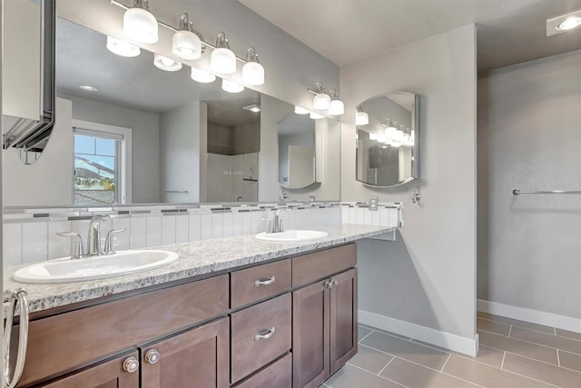 5010 Jeff Dr, Missoula, MT 59803 - full bath with baseboards, tile patterned floors, walk in shower, and a sink