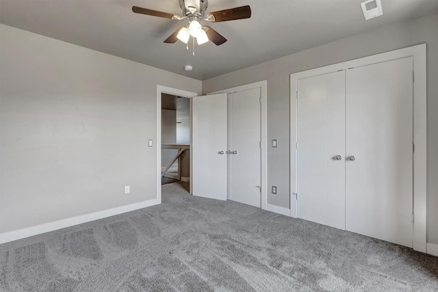 5010 Jeff Dr, Missoula, MT 59803 - unfurnished bedroom with carpet floors, baseboards, two closets, and visible vents
