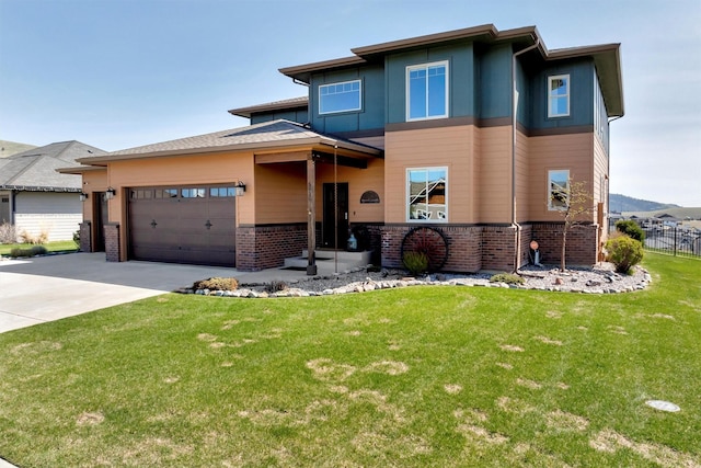 5010 Jeff Dr, Missoula, MT 59803 - prairie-style home with driveway, a garage, brick siding, fence, and a front lawn