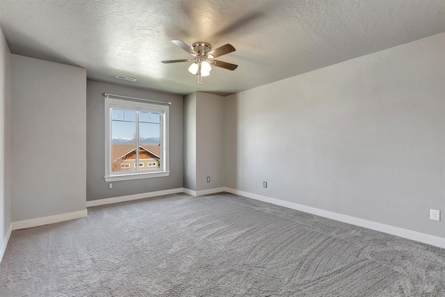 5010 Jeff Dr, Missoula, MT 59803 - carpeted spare room with baseboards, a ceiling fan, a textured ceiling, and visible vents