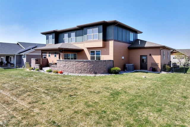 5010 Jeff Dr, Missoula, MT 59803 - back of property with board and batten siding, a yard, and fence
