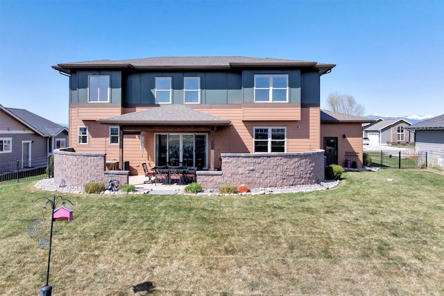 5010 Jeff Dr, Missoula, MT 59803 - back of property with a lawn, fence, and a patio area