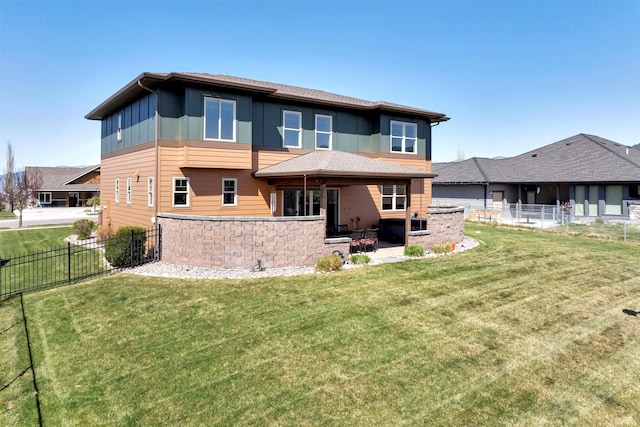 5010 Jeff Dr, Missoula, MT 59803 - back of house with fence, a lawn, and a patio area