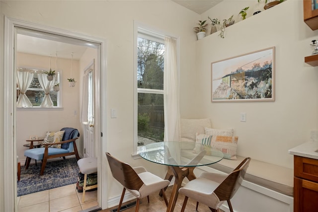 dining space with visible vents and light tile patterned flooring