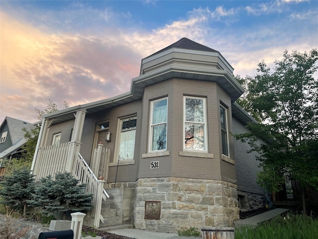 view of front facade featuring stone siding
