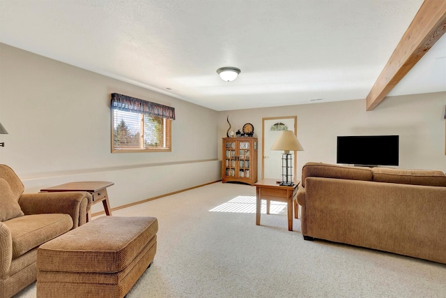 living area featuring carpet floors and baseboards