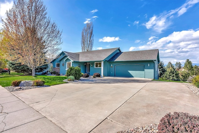 ranch-style home with an attached garage, a shingled roof, a front lawn, and driveway