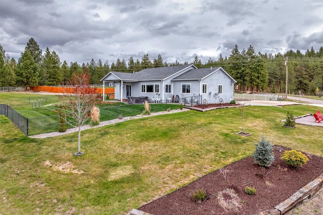 view of front of home with fence and a front yard