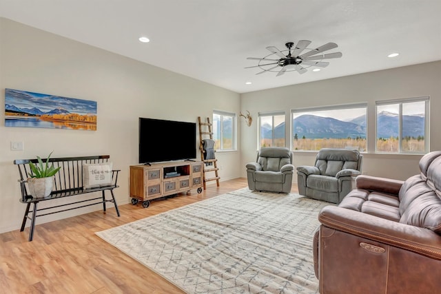 living room featuring recessed lighting, ceiling fan, and light wood finished floors