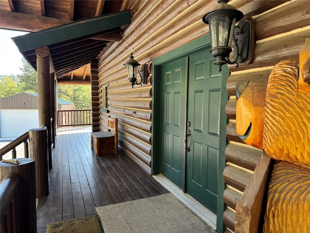 doorway to property with log siding