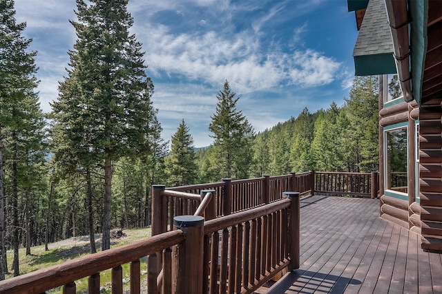 550 Jackson Meadows Rd, Kila, MT 59920 - wooden terrace featuring a view of trees