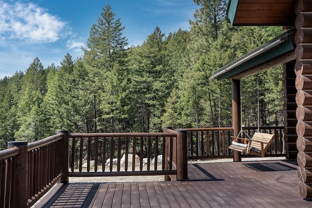 550 Jackson Meadows Rd, Kila, MT 59920 - wooden deck featuring a wooded view