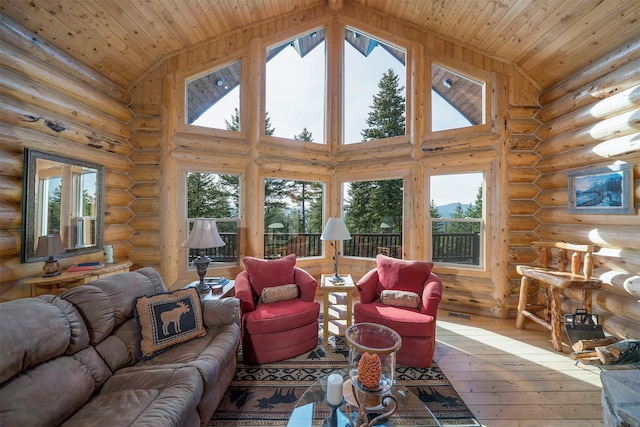 550 Jackson Meadows Rd, Kila, MT 59920 - living room with wooden ceiling, hardwood / wood-style flooring, log walls, and high vaulted ceiling