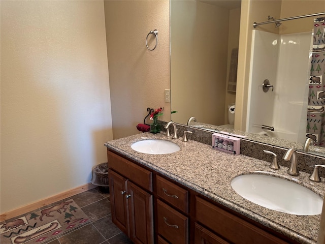 full bathroom featuring double vanity, a sink, baseboards, and a shower with curtain