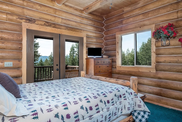 550 Jackson Meadows Rd, Kila, MT 59920 - bedroom featuring access to outside, multiple windows, a wood ceiling with exposed beams, and rustic walls