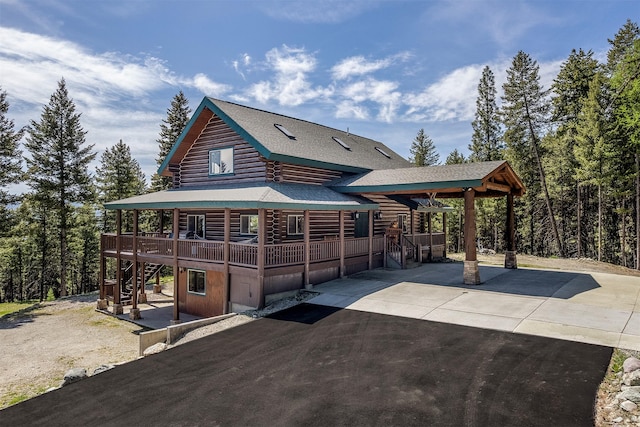 550 Jackson Meadows Rd, Kila, MT 59920 - view of front of house featuring stairs, log exterior, a shingled roof, a porch, and a wooden deck