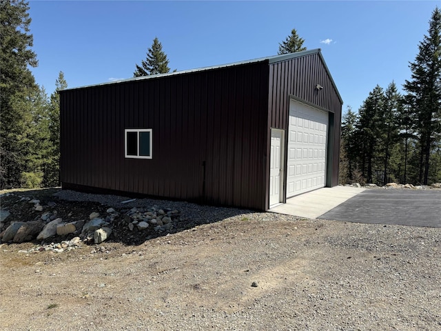 detached garage with aphalt driveway