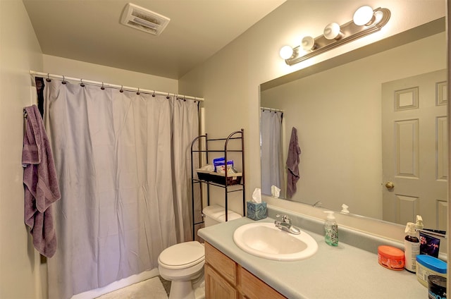 bathroom featuring vanity, a shower with curtain, toilet, and visible vents