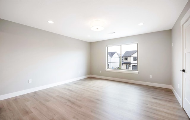 unfurnished bedroom featuring light wood-type flooring, recessed lighting, baseboards, and visible vents