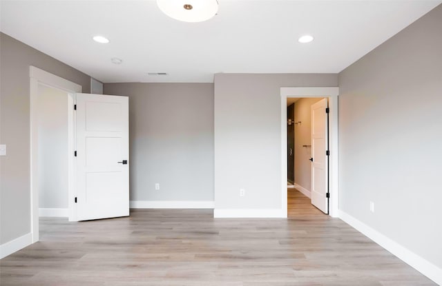 unfurnished bedroom with visible vents, recessed lighting, baseboards, and light wood finished floors