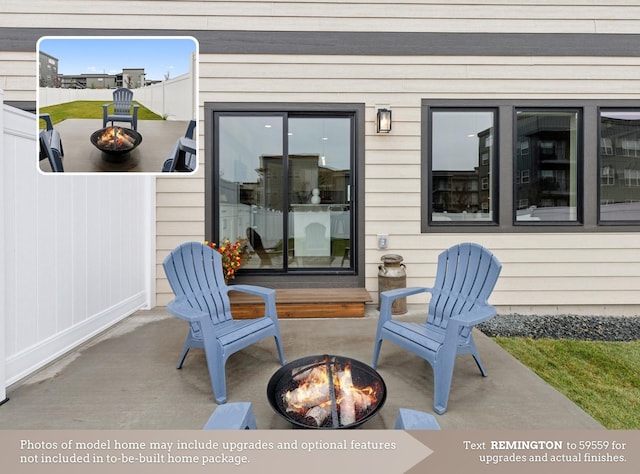 view of patio with a fire pit and fence