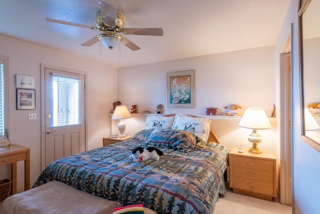 bedroom featuring ceiling fan and light colored carpet