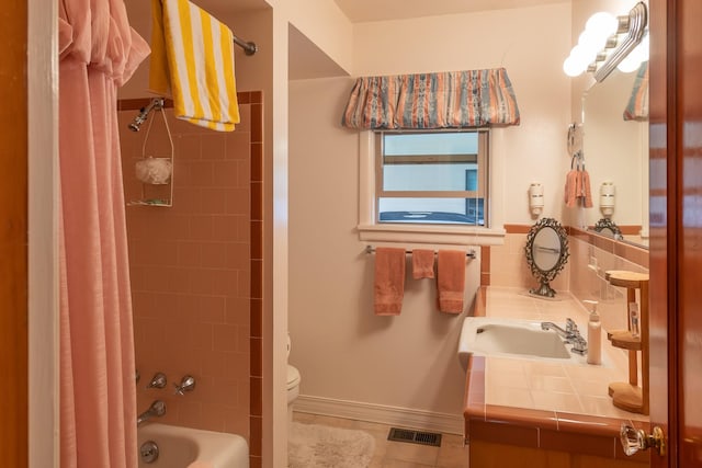 bathroom featuring visible vents, tile patterned flooring, vanity, toilet, and shower / tub combo