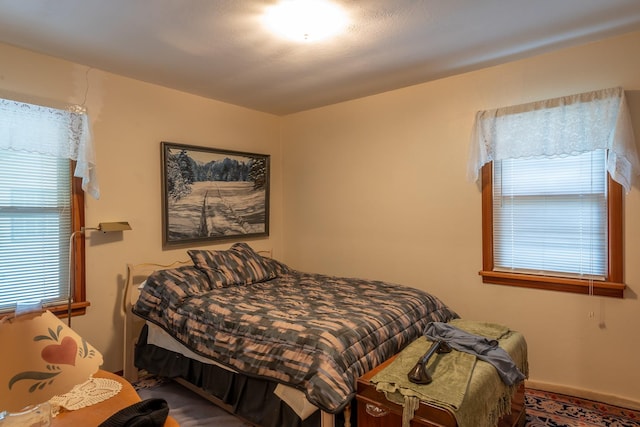 bedroom featuring multiple windows