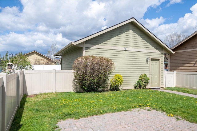 4112A Geary Ln Unit A, Missoula, MT 59808 - view of side of home featuring a yard, a patio, and a fenced backyard