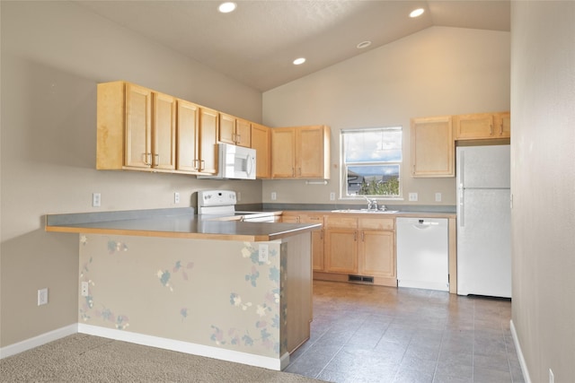 kitchen with white appliances and light brown cabinets