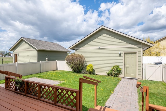 exterior space with a lawn and a fenced backyard