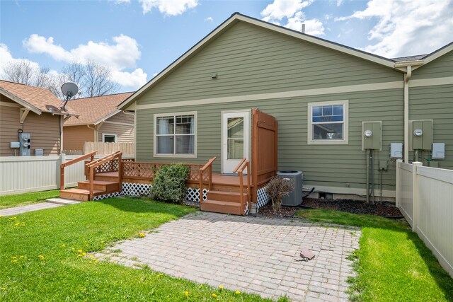 4112A Geary Ln Unit A, Missoula, MT 59808 - back of property featuring fence, a wooden deck, a patio, central air condition unit, and a yard