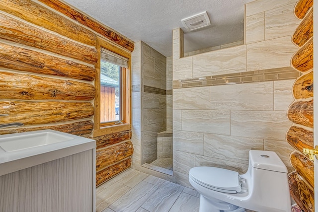 bathroom with walk in shower, a sink, toilet, a textured ceiling, and log walls