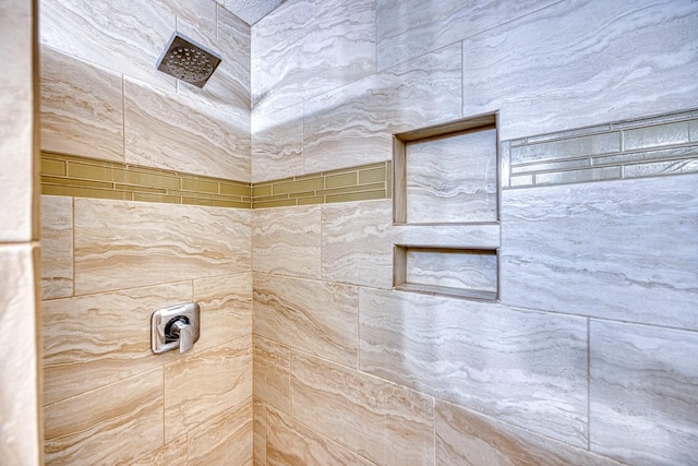 bathroom with tiled shower