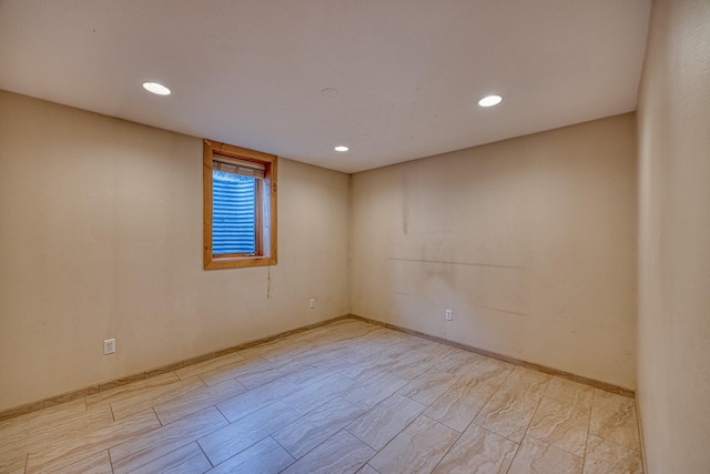 unfurnished room with recessed lighting