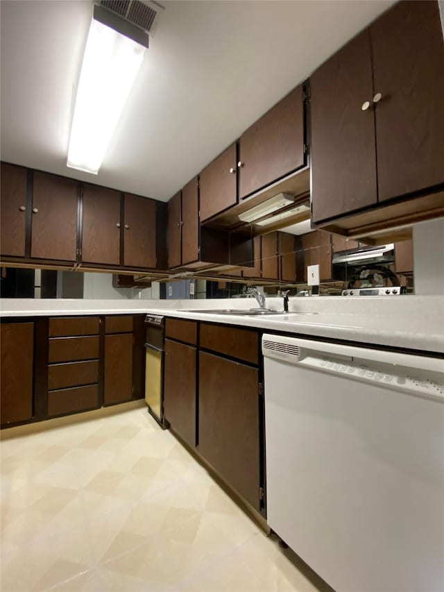 2300 14th Ave S # 5, Great Falls, MT 59405 - kitchen with visible vents, light floors, light countertops, a sink, and dishwasher