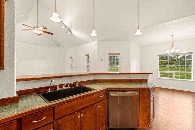 154 Palmer Dr, Kalispell, MT 59901 - kitchen with a sink, a healthy amount of sunlight, lofted ceiling, and dishwasher