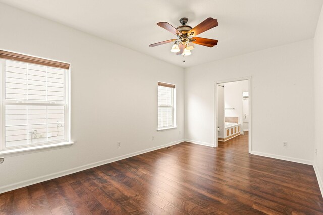154 Palmer Dr, Kalispell, MT 59901 - spare room featuring baseboards, a ceiling fan, and dark wood finished floors