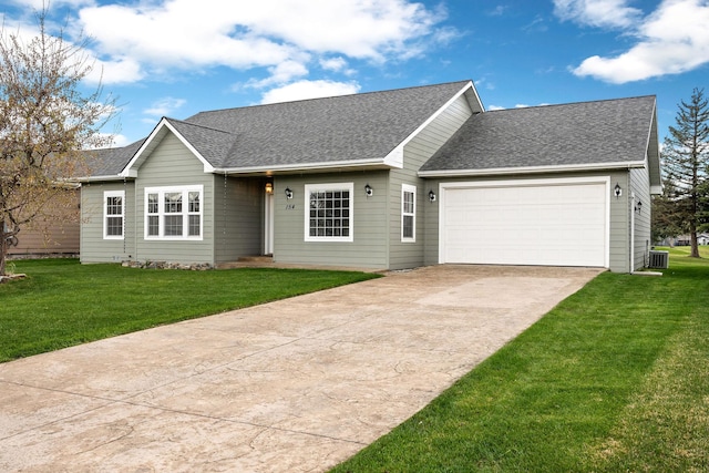 ranch-style house with roof with shingles, an attached garage, driveway, and a front lawn