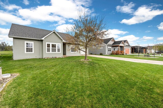 154 Palmer Dr, Kalispell, MT 59901 - ranch-style home featuring a front yard
