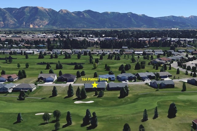 view of community with a residential view, a mountain view, and golf course view