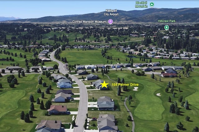 bird's eye view with a residential view, a mountain view, and golf course view