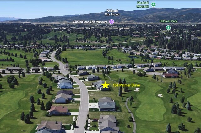 154 Palmer Dr, Kalispell, MT 59901 - bird's eye view with a residential view, a mountain view, and golf course view