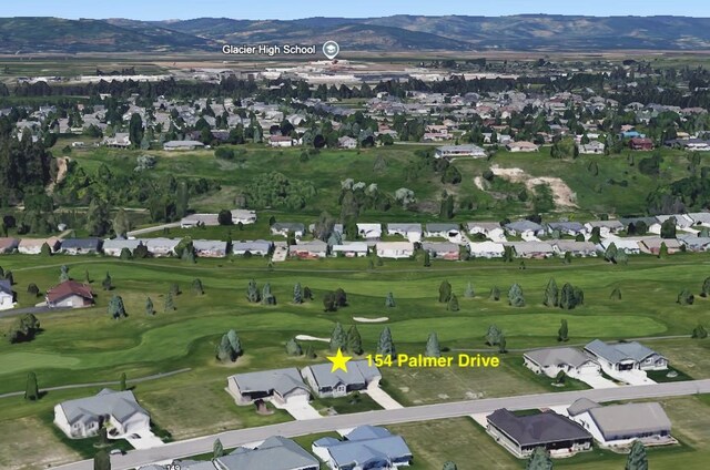 154 Palmer Dr, Kalispell, MT 59901 - bird's eye view with a mountain view, golf course view, and a residential view