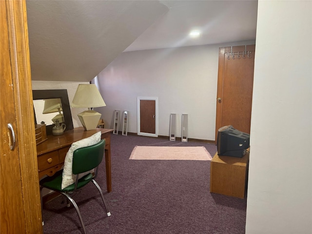carpeted office featuring baseboards