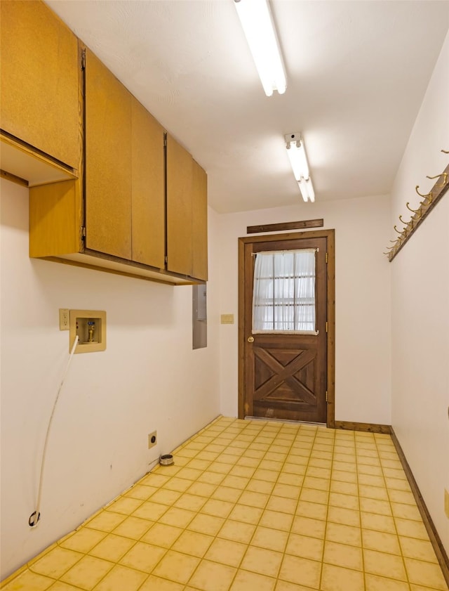 washroom featuring hookup for a washing machine, electric dryer hookup, and cabinet space